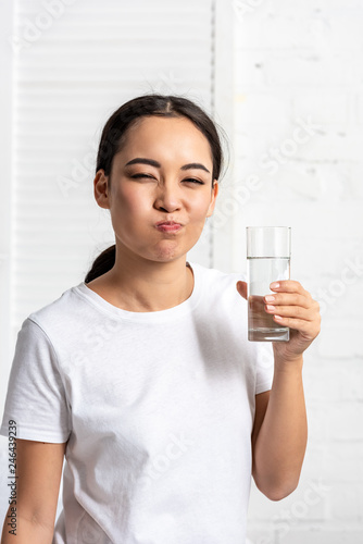 Slika na platnu young asian woman in white t-shirt rinsing mouth with water