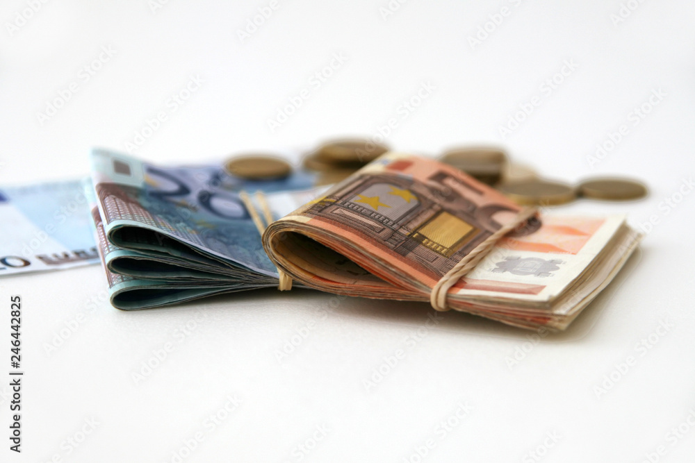 Euro banknotes and coins isolated on white Euro banknotes and coins isolated on white