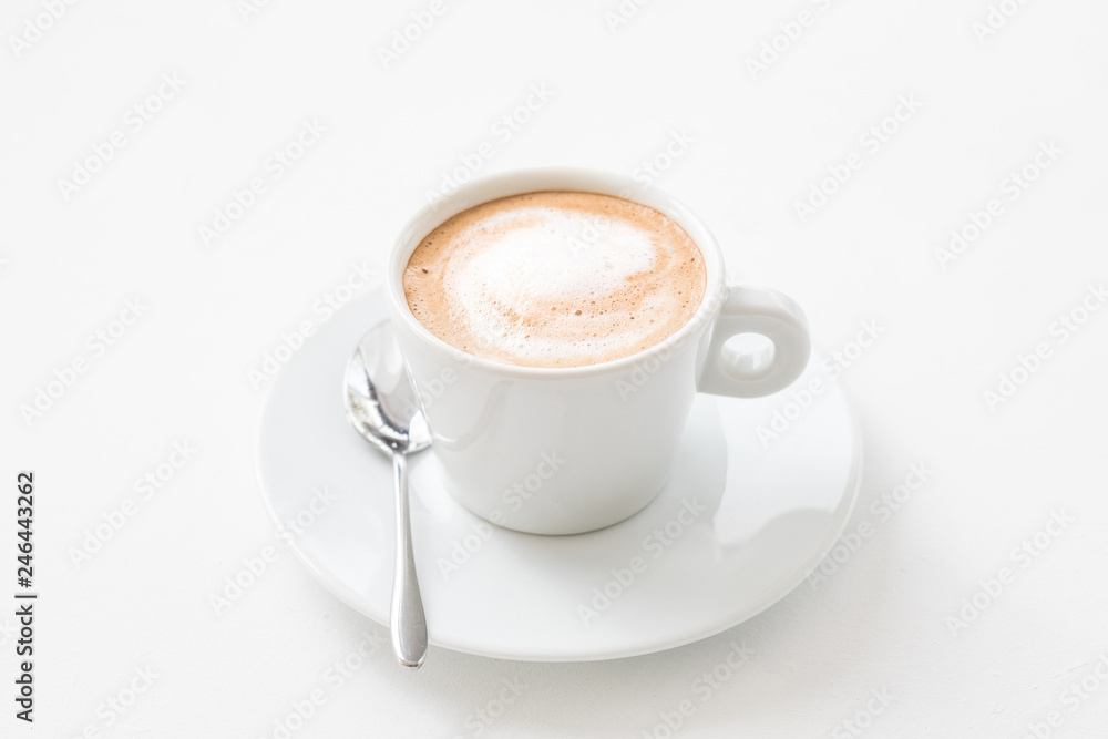Fototapeta Coffee shop concept. Business startup. Cup of hot latte with milk foam on white background.