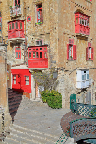 Old street of Valletta in Malta with red balconies.