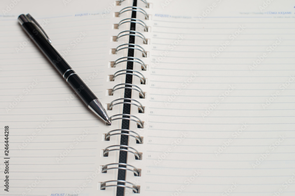 Notebook with black pen, Colorful notepads on the desk, Glasses on the desk with pen and cup of coffee, Computer keyboard with colorful note stick Notebook with black pen, Colorful notepads on the desk, Glasses on the desk with pen and cup of coffee, Computer keyboard with colorful note stick