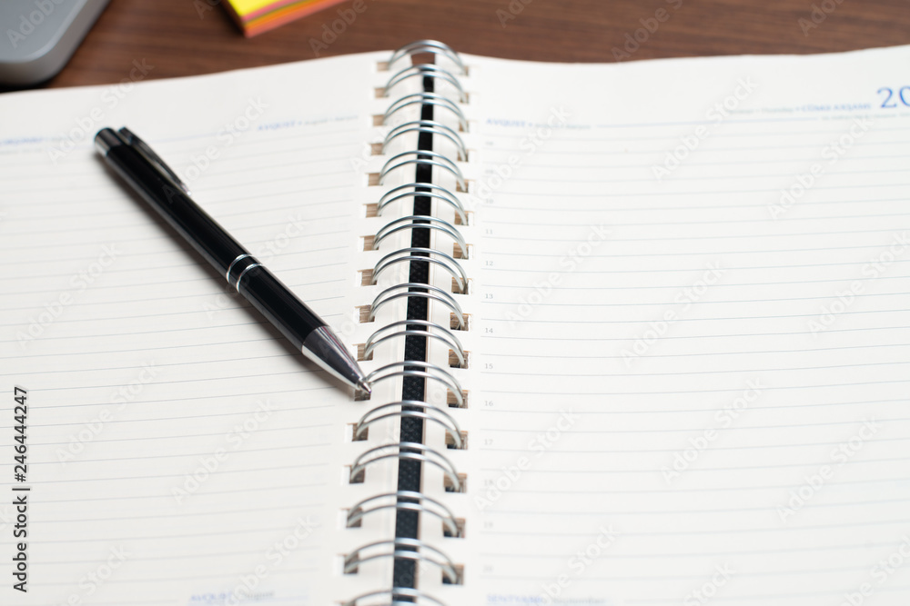 Notebook with black pen, Colorful notepads on the desk, Glasses on the desk with pen and cup of coffee, Computer keyboard with colorful note stick Notebook with black pen, Colorful notepads on the desk, Glasses on the desk with pen and cup of coffee, Computer keyboard with colorful note stick