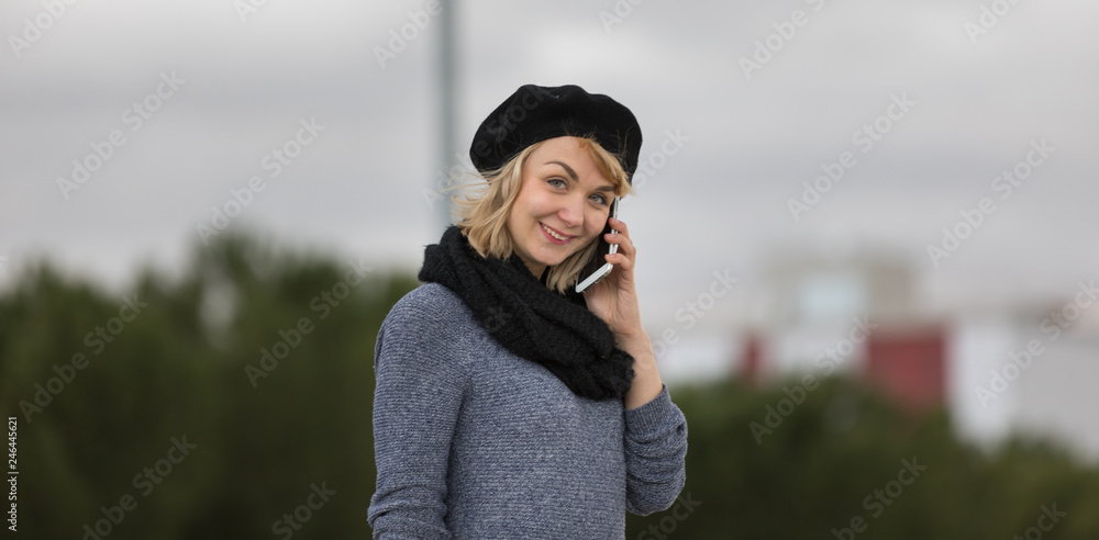 young and blonde girl with casual clothes in the city