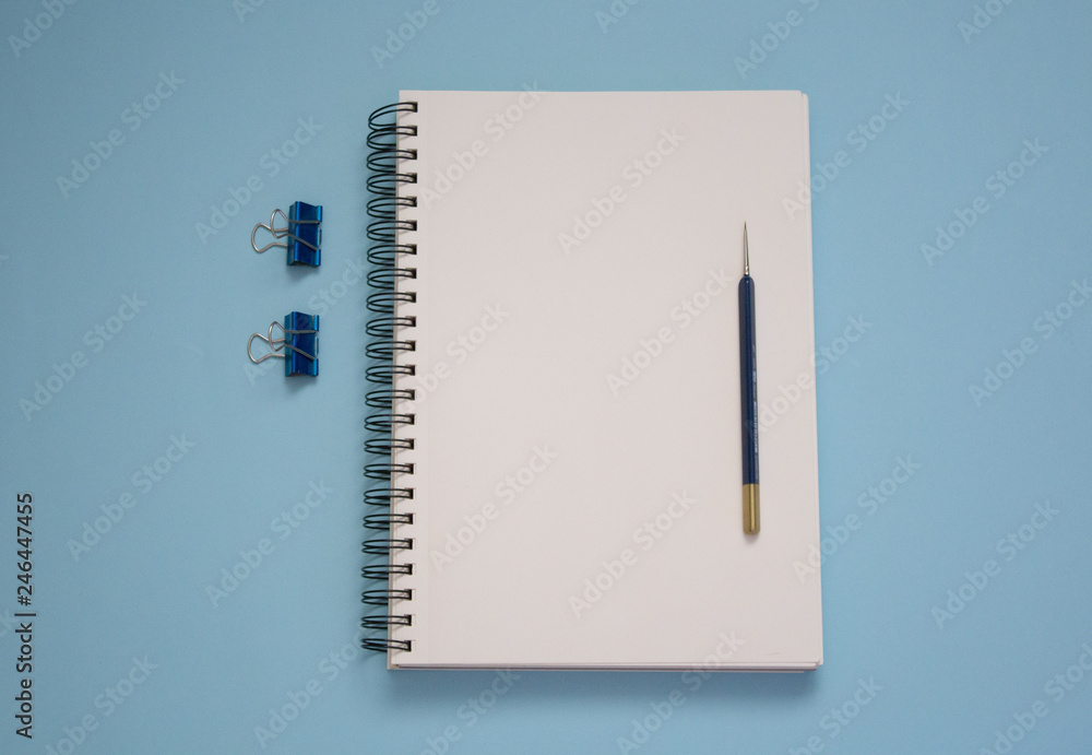 notepad on a blue background notepad on a blue background