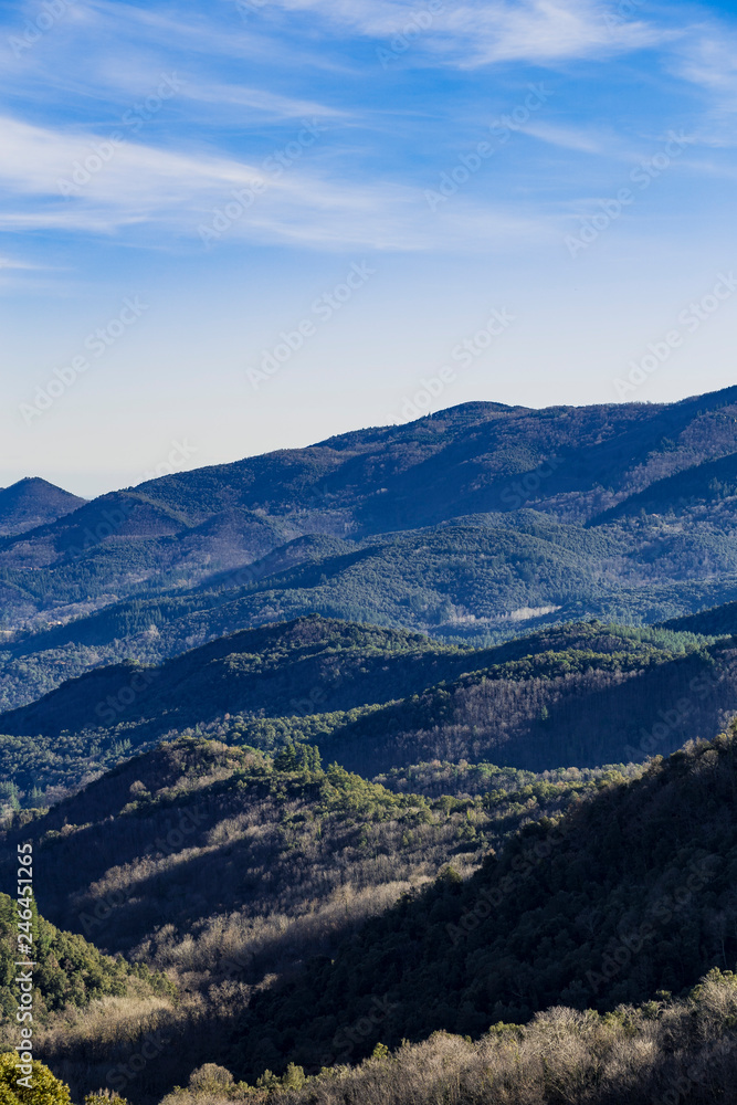 Mountain range landscape on a blue sky in Catalonian Pyrenees from a top view