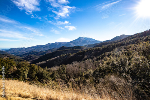 Mountain range landscape on a blue sky in Catalonian Pyrenees from a top view