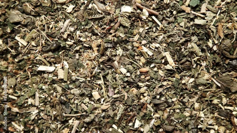 Green dried mix herbs background. Top view. Alternative herbal medicine Green dried mix herbs background. Top view. Alternative herbal medicine