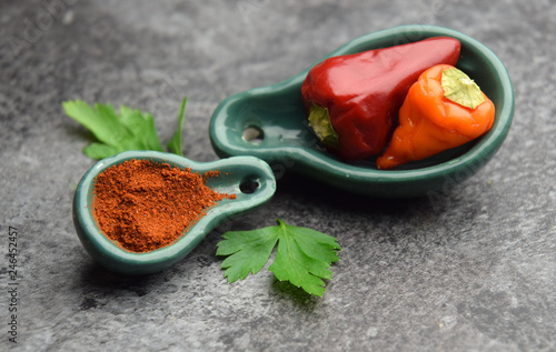 Raw ripe fresh red pepper with powder spice