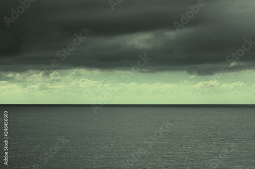 stormy black sky over the sea © Roman
