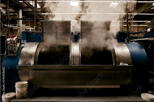 Steam emitting from washing machine in factory photo