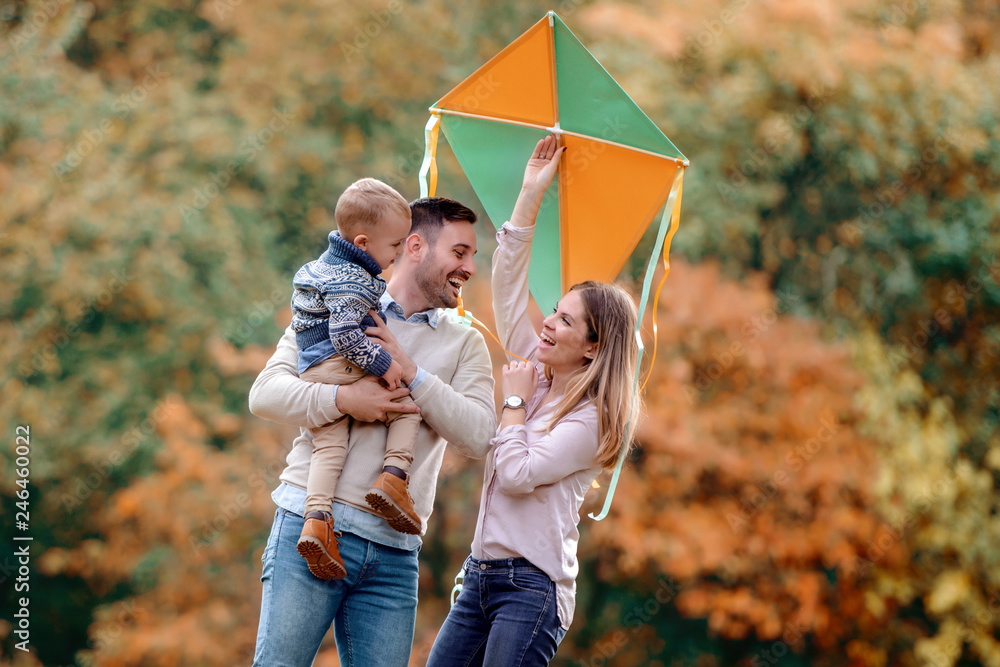 Fotografie Happy family enjoying picnic in nature