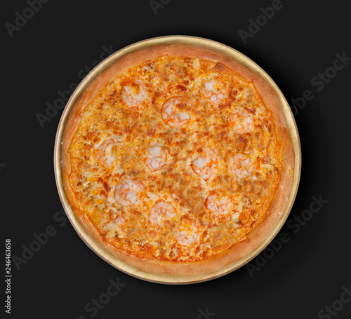 Isolated image of pizza with shrimps and olives on a black background