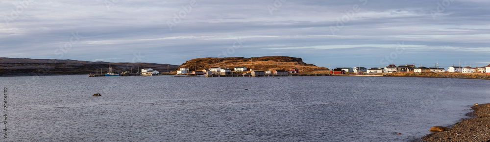 Small town on the Atlantic Ocean Coast during a cloudy evening. Taken in Raleigh, Northern Newfounland, Canada.