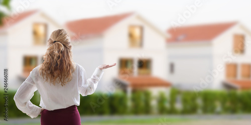 woman showing the house for sale, buy house