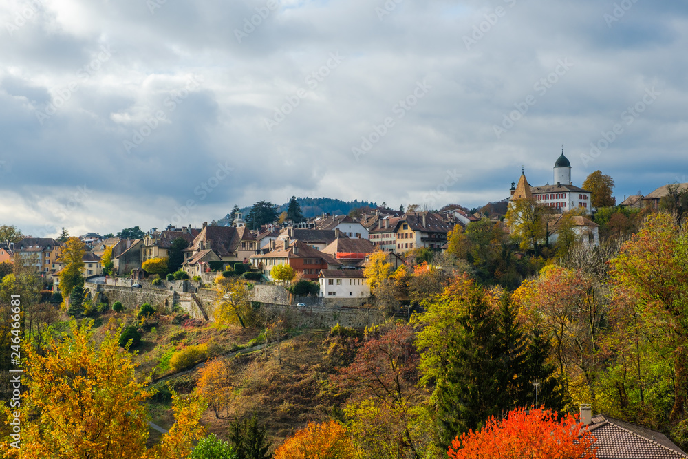 A beautiful view of the historical Aubonne village, Switzerland in a fantastic colorful autumn landscape.