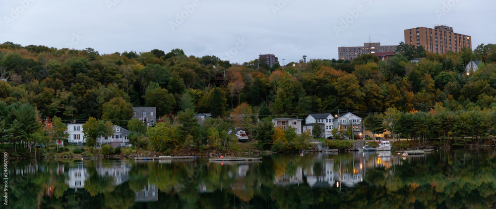 Armdale, Halifax, Nova Scotia, Canada - October 7, 2018: Residential homes by the water during a cloudy sunrise. Armdale, Halifax, Nova Scotia, Canada - October 7, 2018: Residential homes by the water during a cloudy sunrise.