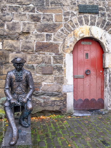 Penn-Soldat, a bronze sculpture of a gatekeeper in front of the Marschiertor Gate at Aachen, Germany photo