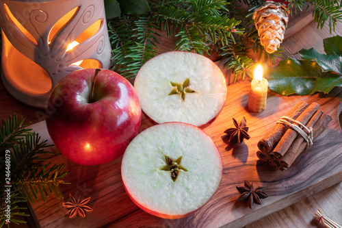 Obraz na plátně Christmas decoration with apples cut in two halves with a star