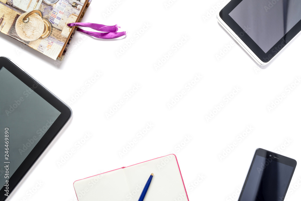 Modern gadgets, a notebook with a pen and a vintage album, arranged in a circle, isolated on a white background. Modern gadgets, a notebook with a pen and a vintage album, arranged in a circle, isolated on a white background.