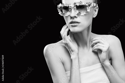 Fashion photo of beautiful model wearing floral sunglasses