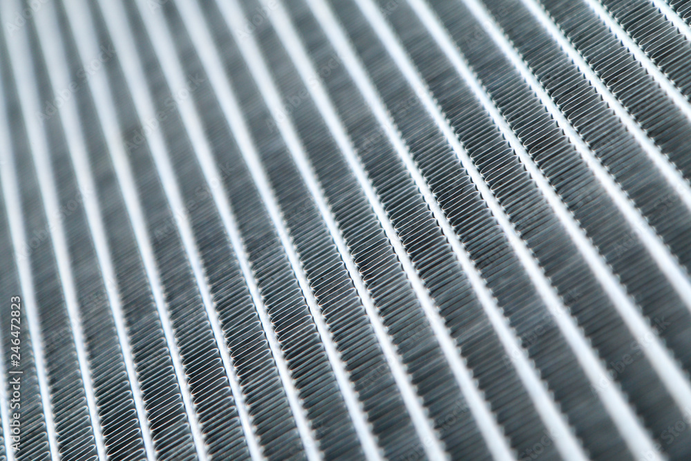 A detail of a ribbing of the car´s aluminium sport radiator. A detail of a ribbing of the car´s aluminium sport radiator.