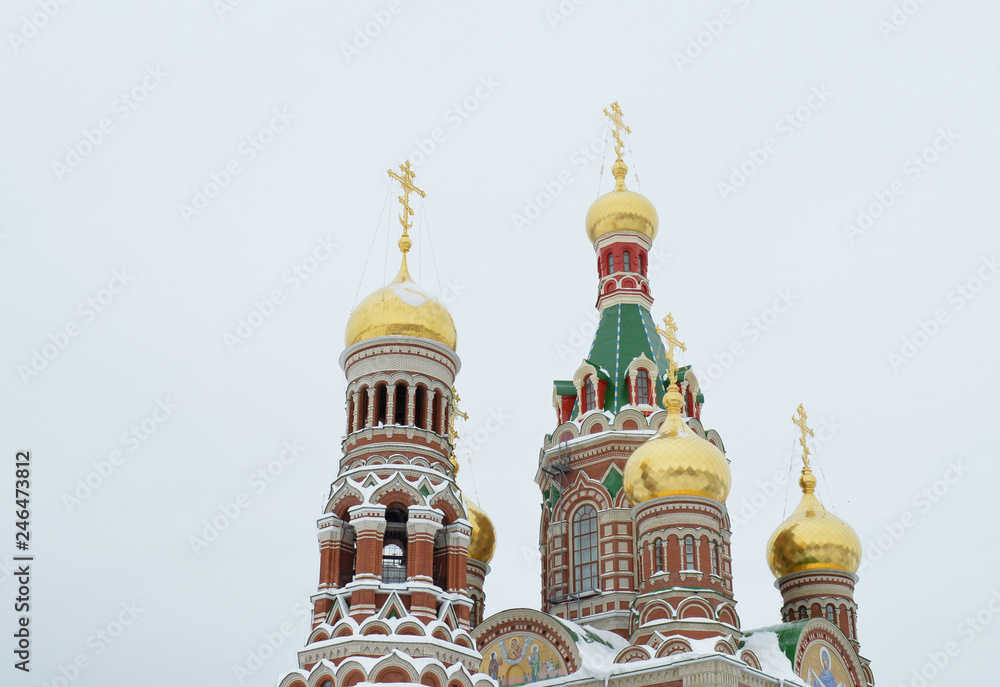 winter urban landscape with snow from buildings and Orthodox Church