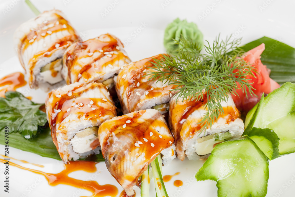 Japanese national popular cuisine. Sushi, rice and fish. Tasty, beautifully served food in a restaurant, cafe, with elements of the original design. Japanese national popular cuisine. Sushi, rice and fish. Tasty, beautifully served food in a restaurant, cafe, with elements of the original design.