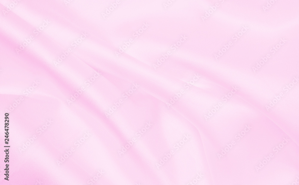 Obraz premium Smooth elegant pink silk or satin texture as wedding background. Luxurious background design