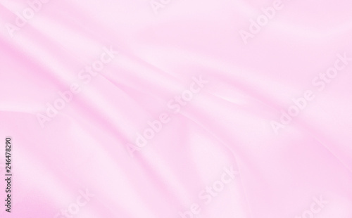 Smooth elegant pink silk or satin texture as wedding background. Luxurious background design