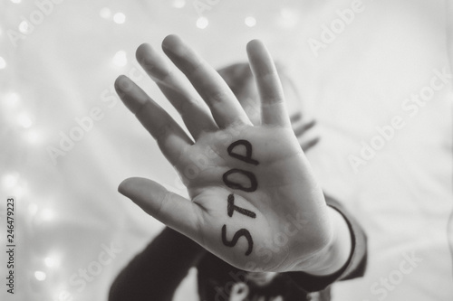 Little frightened girl shows the word 