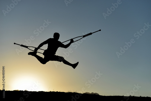 disabled man flying with crutches