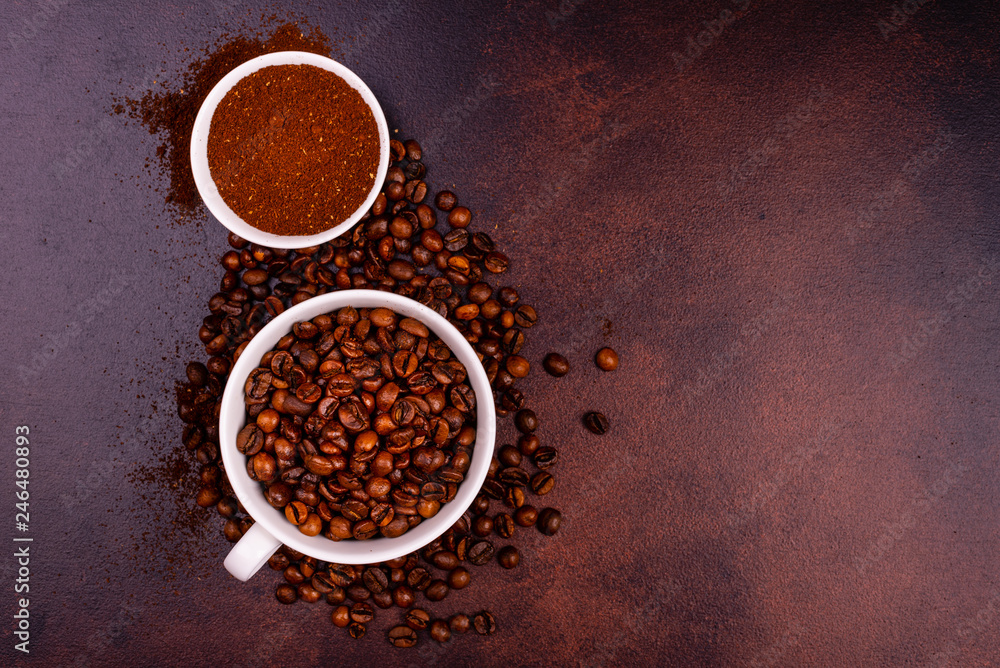 Seeds of fragrant coffee, coffee drink on a dark concrete background. It can be used as a background Seeds of fragrant coffee, coffee drink on a dark concrete background. It can be used as a background