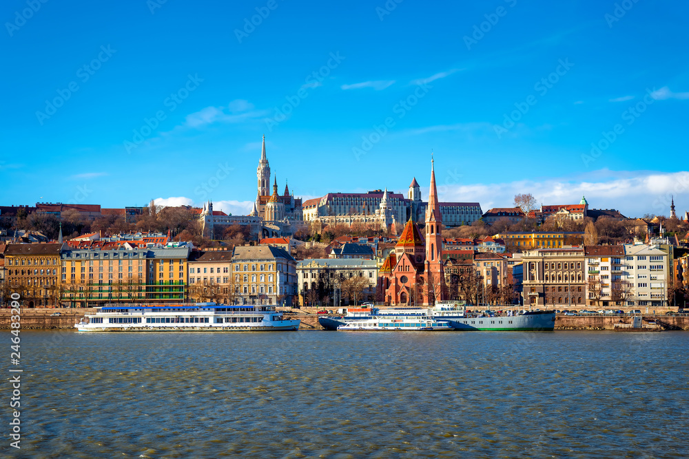 View of the Buda from Pest. The Fisherman's Bastion, the Matthias Church and Protestant church. Budapest, Hungary
