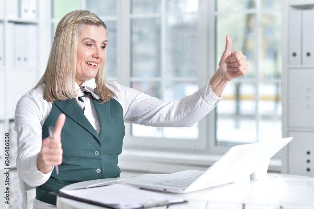 senior woman in formal wear working in office senior woman in formal wear working in office