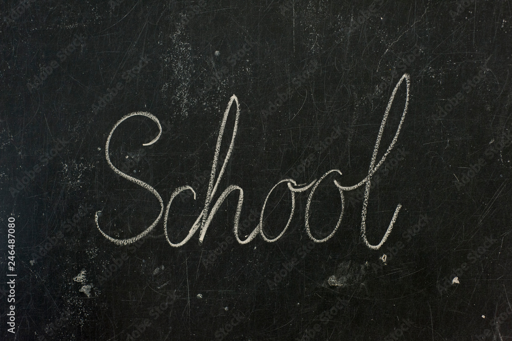Word SCHOOL written on chalk board Word SCHOOL written on chalk board