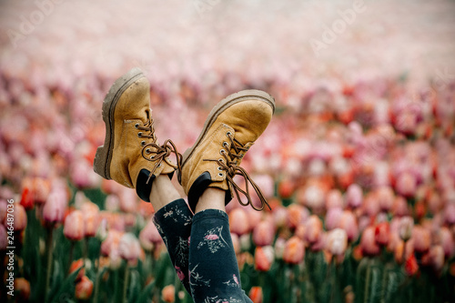 Young girl with legs up into nature