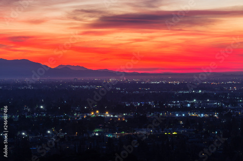 Colorful predawn view of San Fernando Valley neighborhoods and the San Gabriel Mountains in the city of Los Angeles, California. 