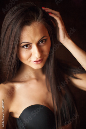 Hot brunette girl posing at the interior home studio