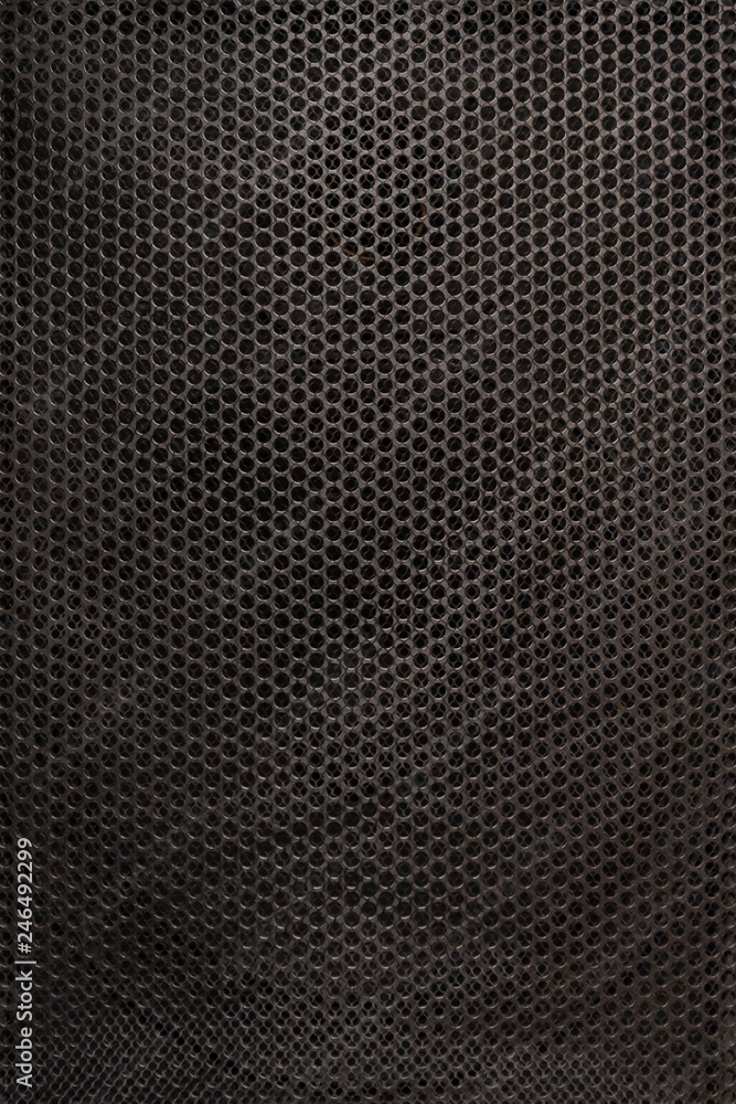 The texture of the protective grid audio speakers. Close view. Black safety net The texture of the protective grid audio speakers. Close view. Black safety net