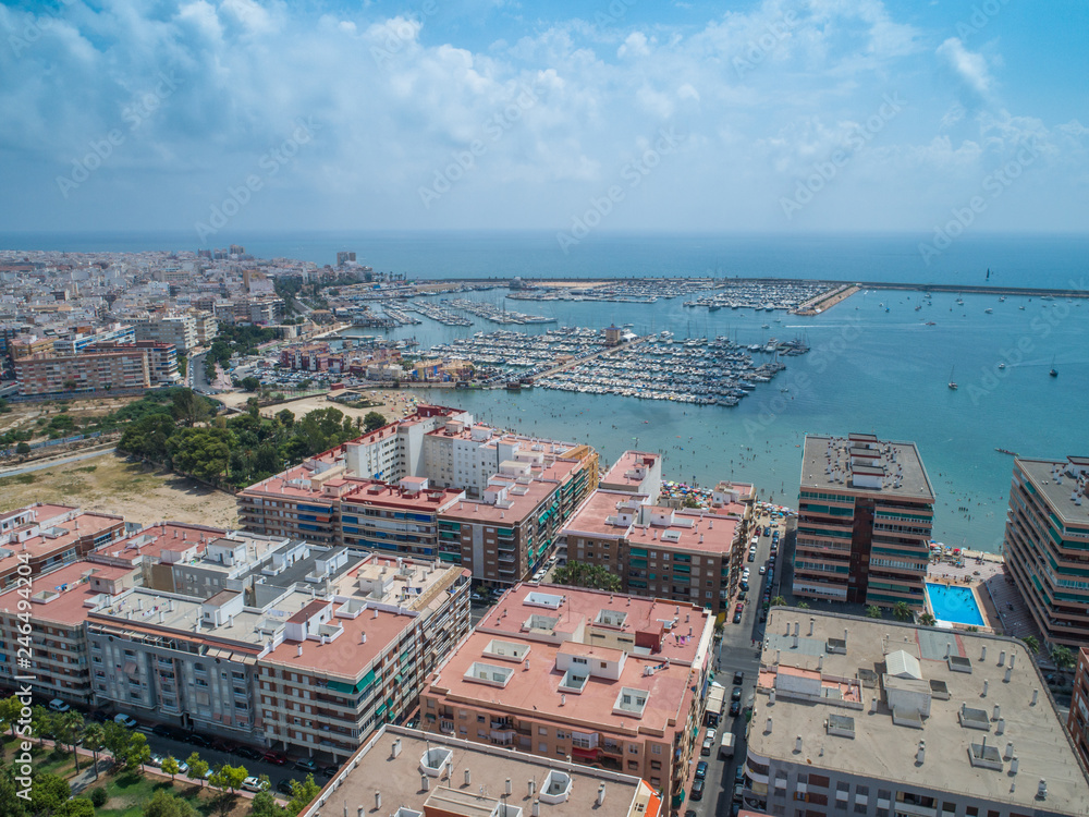 Aerial photo of harbour, residential houses, highways and Mediterranean Sea of Torrevieja. High angle view famous popular travel destinations for travellers. Costa Blanca. Alicante province. Spain 10