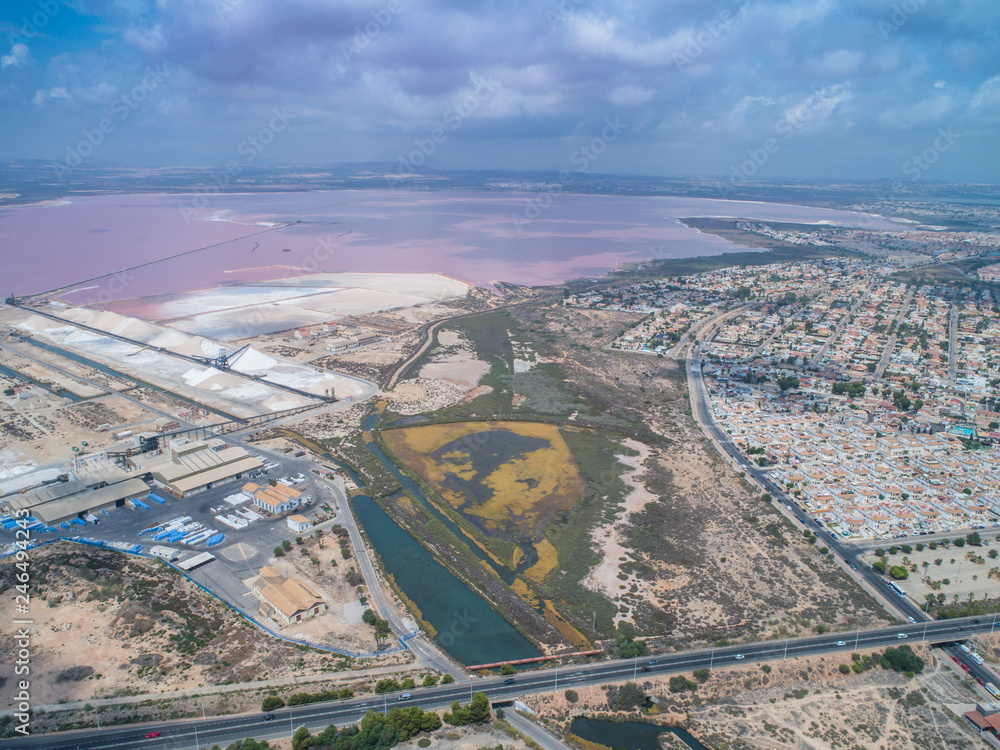 Salinas of Torrevieja. Aerial wide view on rose salty lake and small bungalows and highway to Cartagena 2