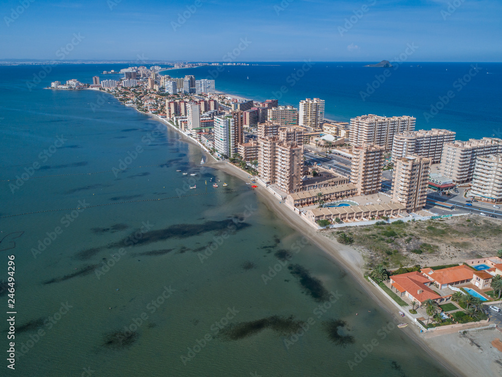 Aerial photo of tall buildings and the beach on a natural spit of La Manga between the Mediterranean and the Mar Menor, Cartagena, Costa Blanca, Spain 3 Aerial photo of tall buildings and the beach on a natural spit of La Manga between the Mediterranean and the Mar Menor, Cartagena, Costa Blanca, Spain 3
