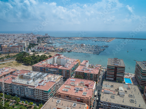 Aerial photo of harbour  residential houses  highways and Mediterranean Sea of Torrevieja. High angle view famous popular travel destinations for travellers. Costa Blanca. Alicante province. Spain 10