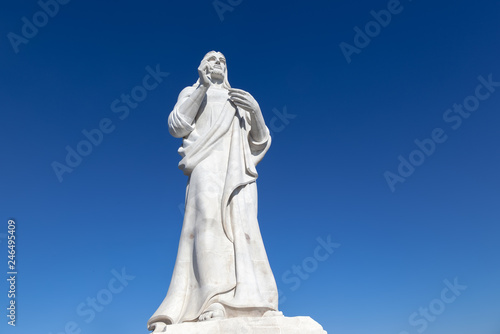 statue of Jesus Christ in Havana on background blue sky  Cuba