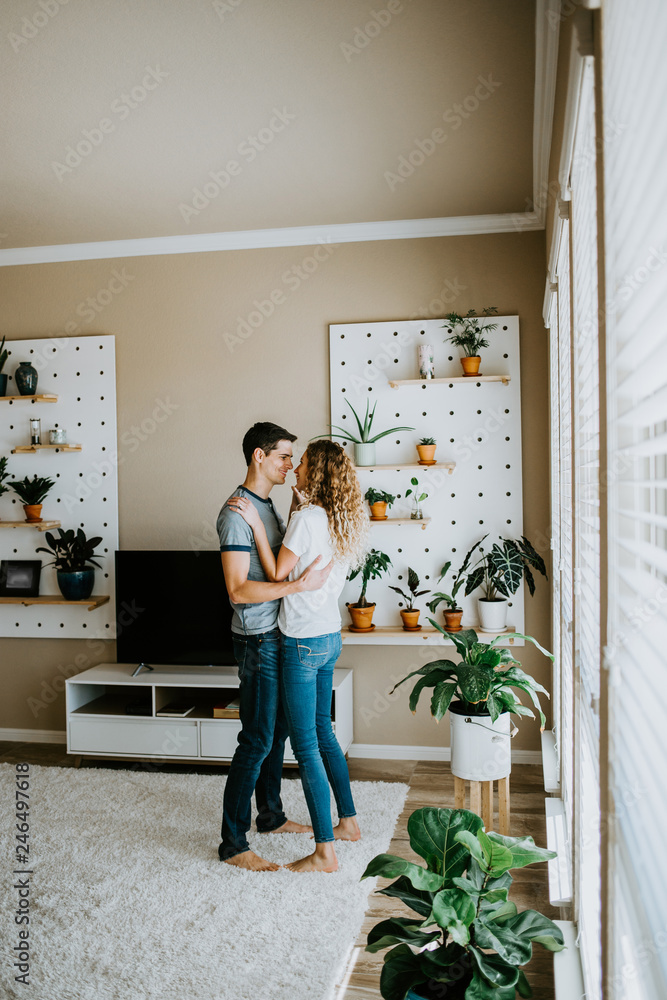 Happy Couple Dancing in Modern Living Room Happy Couple Dancing in Modern Living Room