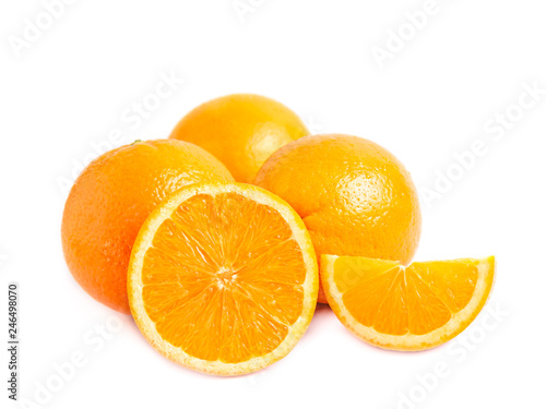 Three fresh juicy oranges one half and a lobule (slice)  of orange isolated on white background. Close photo