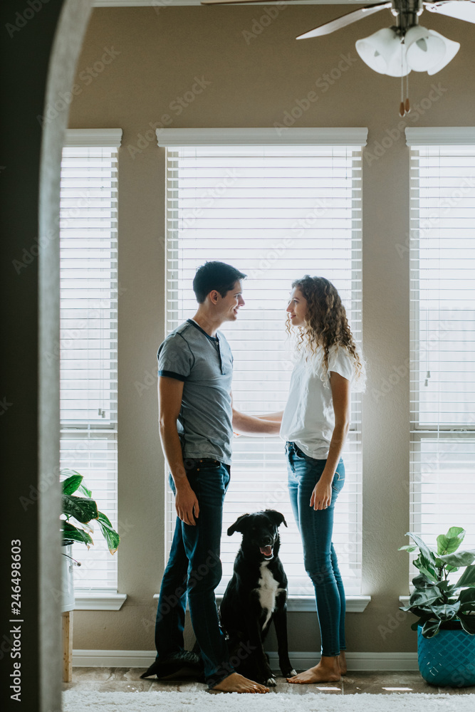 Happy Couple with dog at home