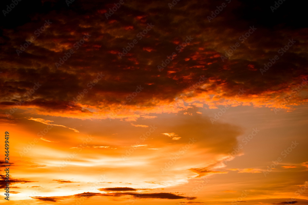 Dramatic sunset colorful red and orange sky over and cloud background multicolor evening sky