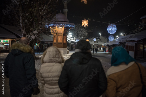 tourist looking  at Sebilj in Sarajevo  photo