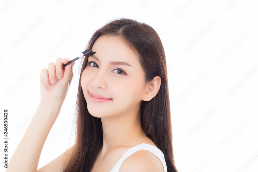 Beautiful portrait young asian woman applying eyebrow or eyelash with makeup brush isolated on white background, beauty asia girl prefect with cosmetic concept. Beautiful portrait young asian woman applying eyebrow or eyelash with makeup brush isolated on white background, beauty asia girl prefect with cosmetic concept.